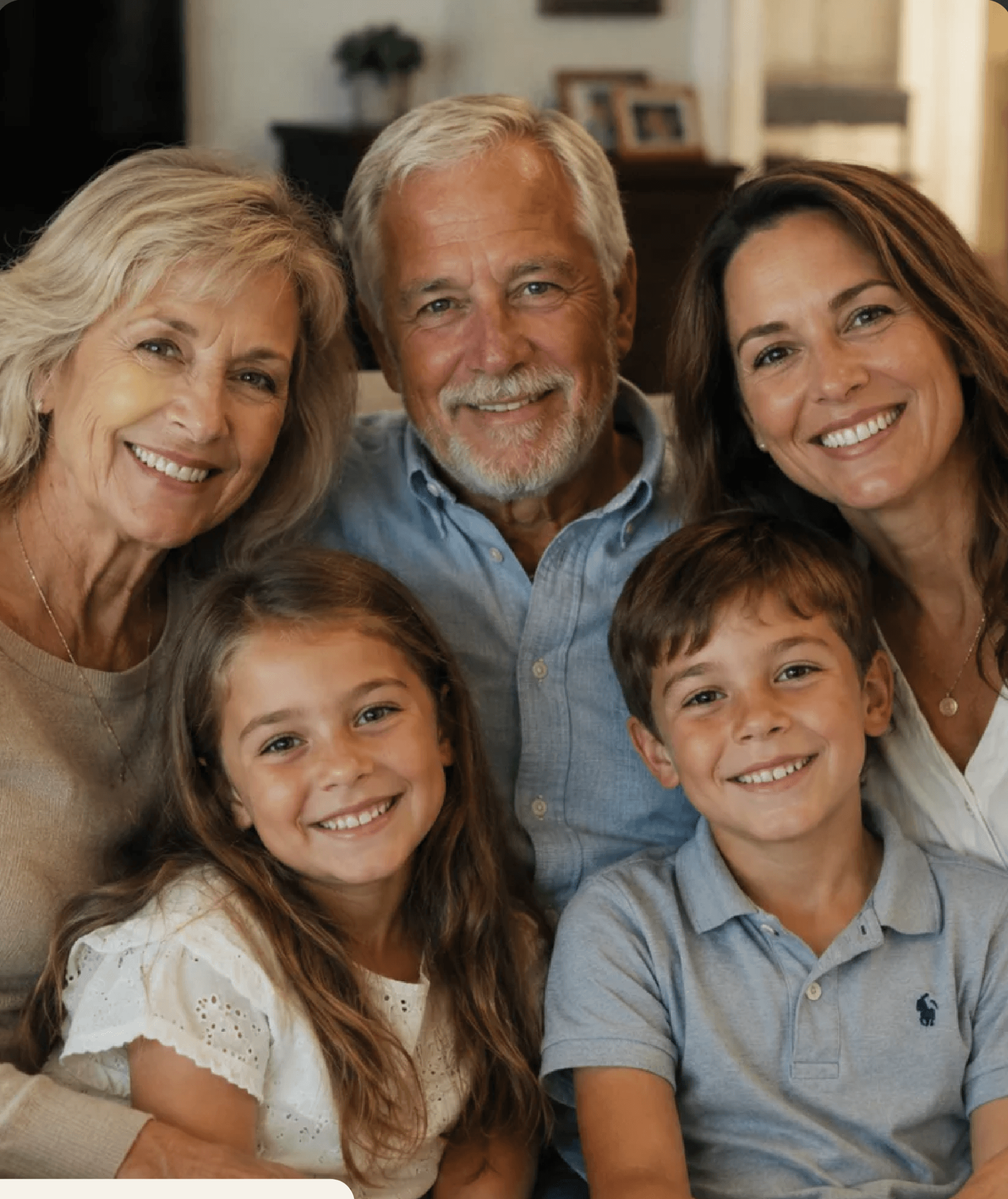 Three generations of a family together at home, smiling